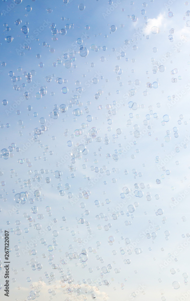 Soap bubbles fly in the blue sky Soap bubbles fly in the blue sky