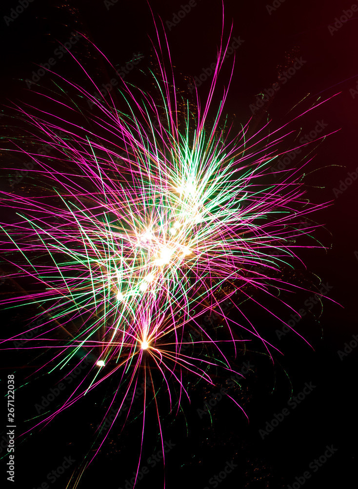 Beautiful sparks from fireworks in the sky at night Beautiful sparks from fireworks in the sky at night
