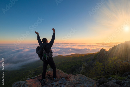 A man in mountain sunset autumn