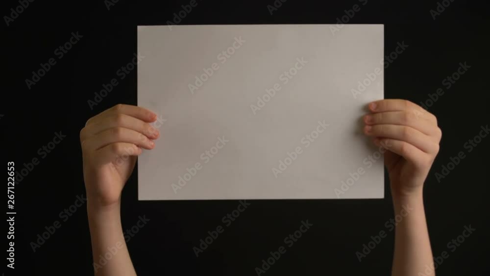 Hand holding empty paper Hand holding empty paper
