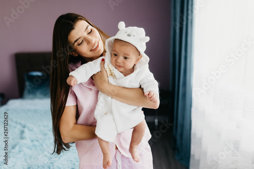 Portrait of a happy young mother with a little baby boy.