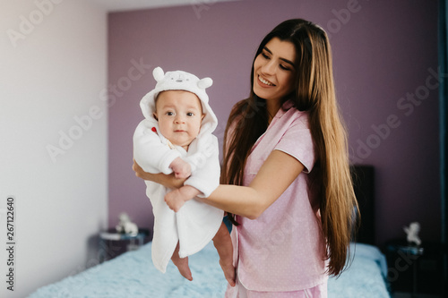 Portrait of a happy young mother with a little baby boy.