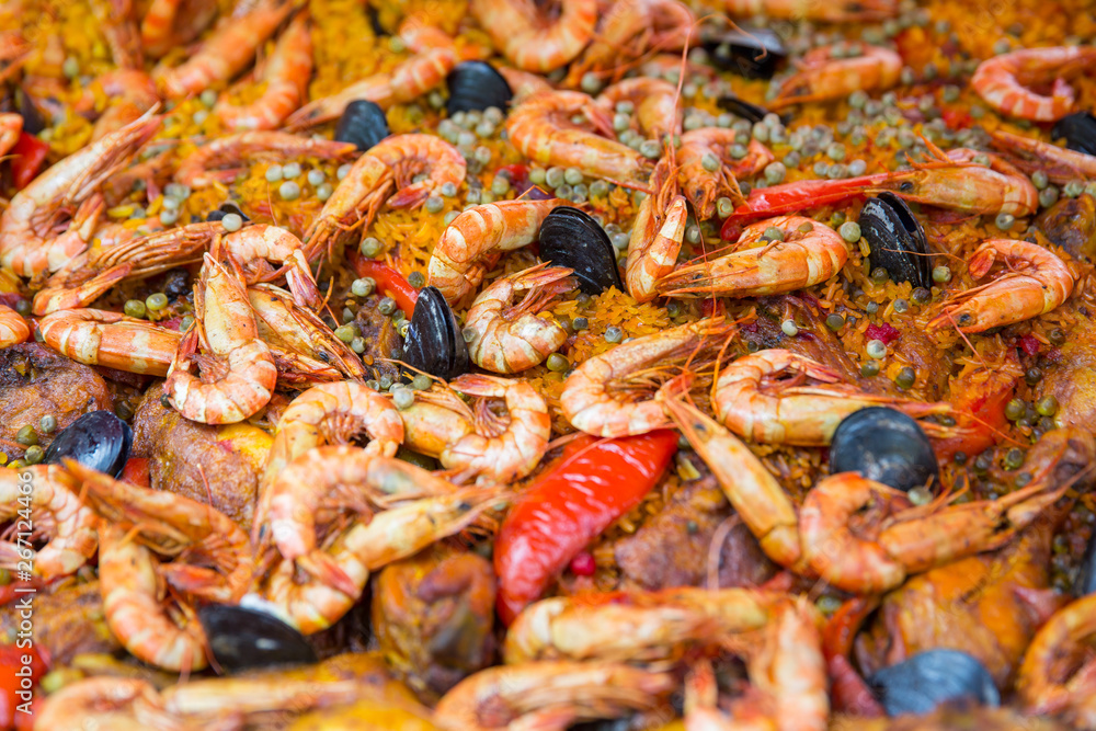 Spanish paella pan with seafood. Homemade paella with shrimps, pawns and mussel, Provence, Bouches-du-Rhône, France