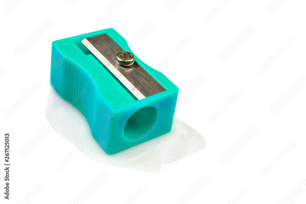 Large pencil sharpener on a white isolated background, close-up with space for the text. Large pencil sharpener on a white isolated background, close-up with space for the text.
