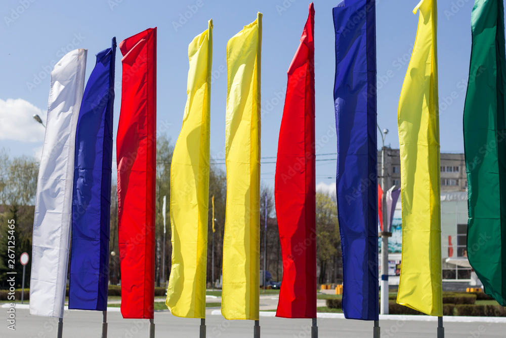 colored holiday flags on the Sunny streets of the city