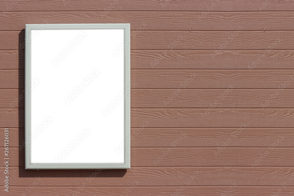 Fototapeta premium empty blank white mock up board on brown wood panels wall background.