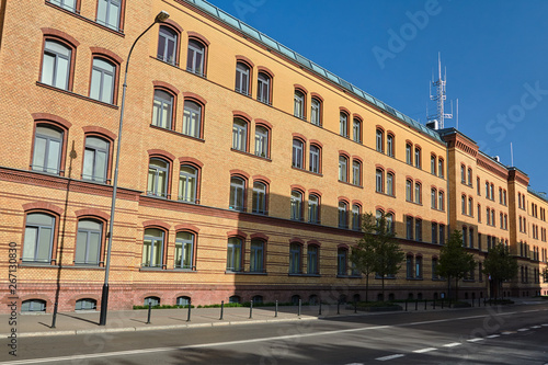 brick wall of a historic building of former barracks in Poznan. © GKor