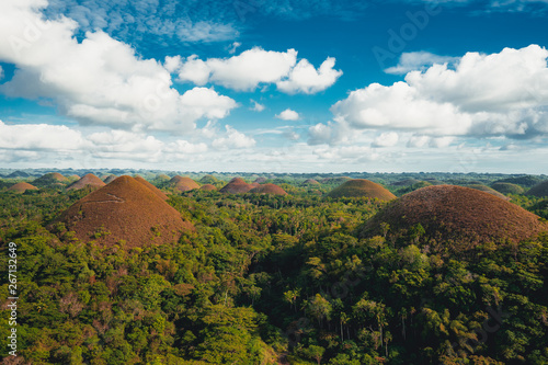 Chocolate Hills in the Bohol island in the Philippines, covered in brown grass. Famous touristic place