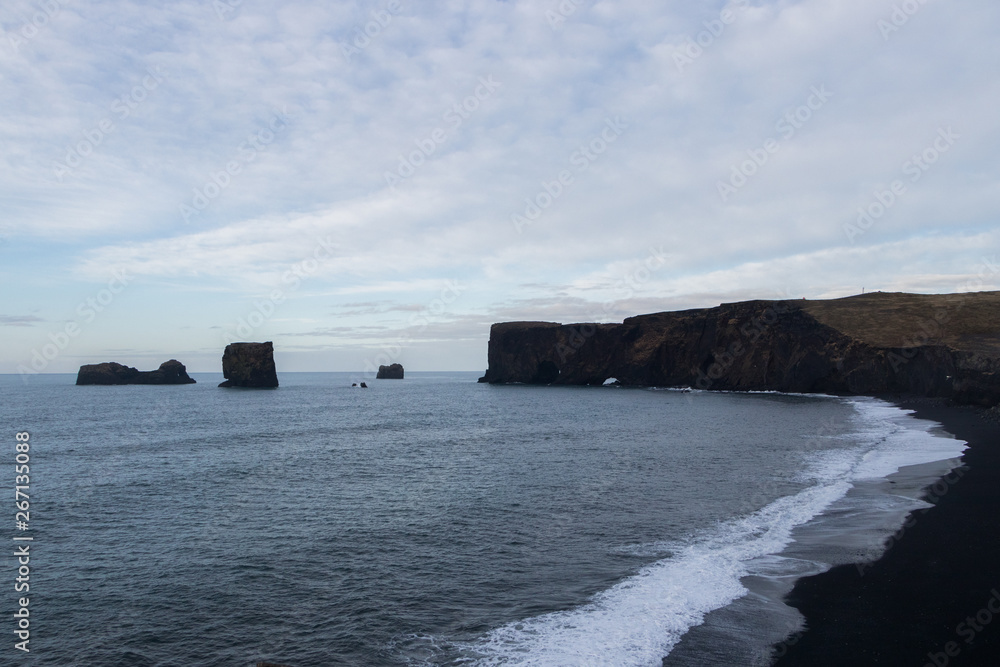 Reynisfjara is a world-famous black-sand beach found on the South Coast of Iceland Reynisfjara is a world-famous black-sand beach found on the South Coast of Iceland