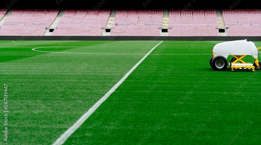 Obraz premium Aeriarion and cutting grass lawn on football playing field