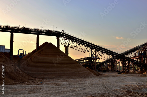 Sand Making Plant in mining quarry. Crushing factory  machines and equipment for crushing  grinding stone  sorting sand and bulk materials.
