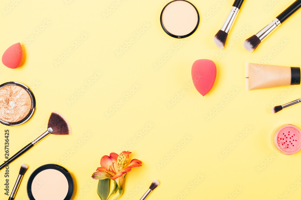 Bright yellow makeup background of cosmetics Bright yellow makeup background of cosmetics