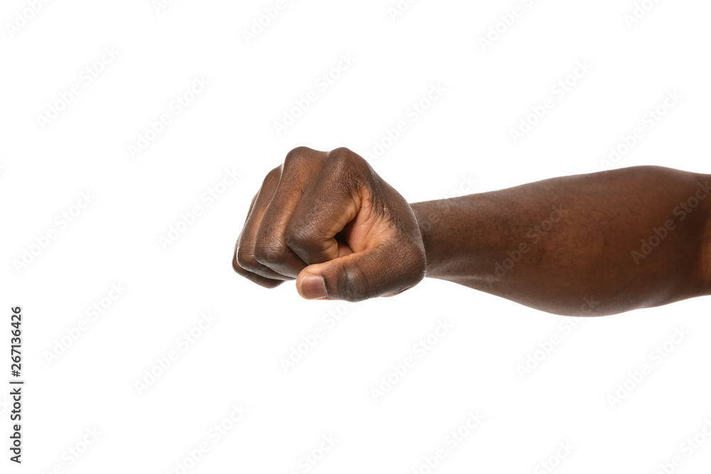 African-American man showing fist on white background, closeup African-American man showing fist on white background, closeup