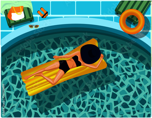 beautiful girl swims on the mattress  in the pool