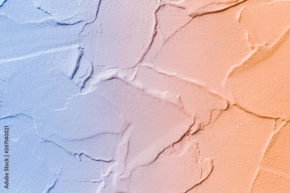 Fototapeta premium Abstract gradient texture, blue and orange plaster background, painted texture
