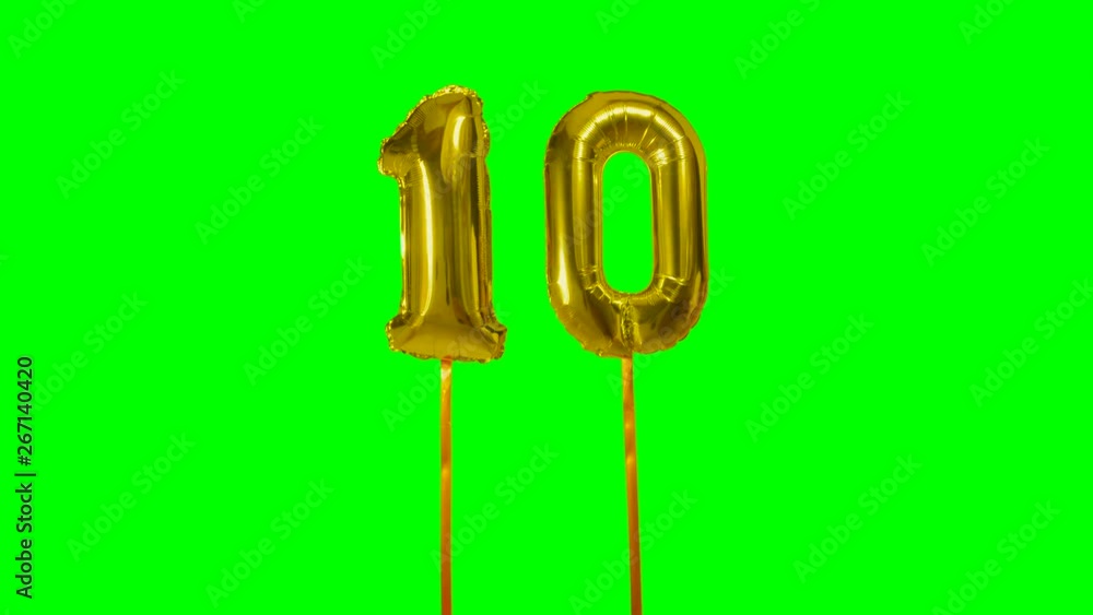 Number 10 ten years birthday anniversary gold balloon floating on green screen Number 10 ten years birthday anniversary gold balloon floating on green screen