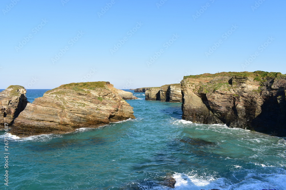 Cliff with blue sky. As Catedrais beach with high tide, Ribadeo, Spain.