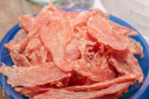 Dried meat 300 grams lies on plastic scales