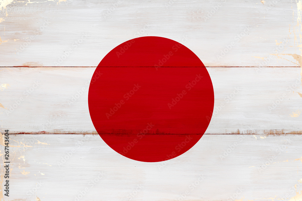 Flaga Japonii malowana na starej desce.
