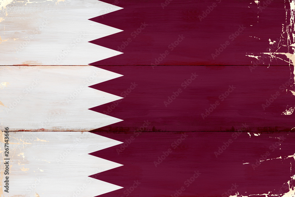 Fototapeta premium Flaga Kataru malowana na starej desce.