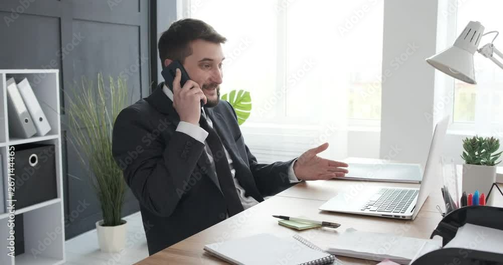 Businessman speaking on phone call Businessman speaking on phone call