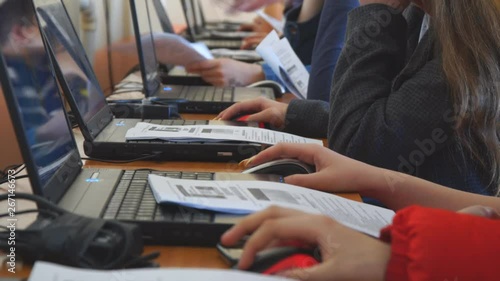 Students in front of computers in a computer class.