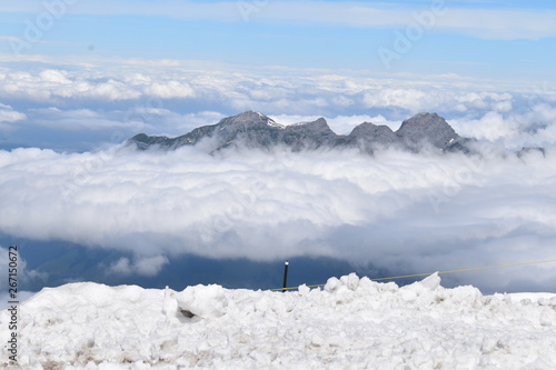 Snow mountains above the clouds