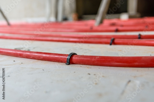 Wallpaper Mural Tubes of the underfloor heating system on a styrofoam insulation Torontodigital.ca