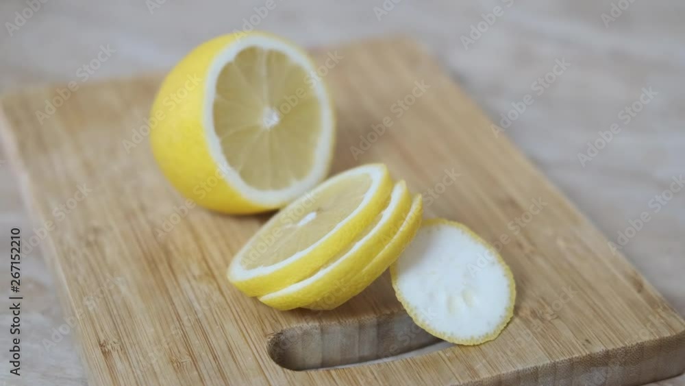 Sliced lemon. Sliced lemon on a wooden board. Sliced lemon. Sliced lemon on a wooden board.