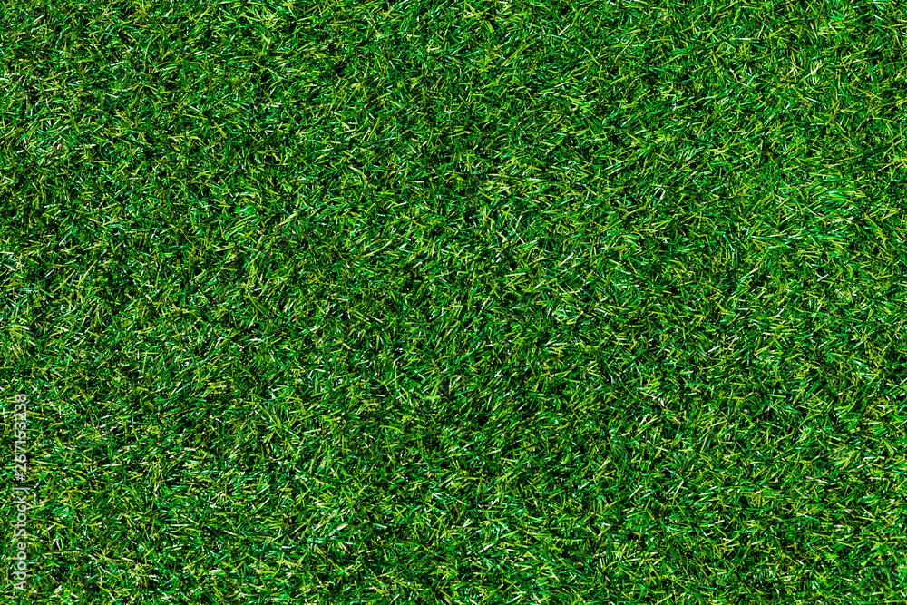 Fototapeta premium Top View Green Grass, Artificial Soccer Coverage, Field Or Lawn. Fake Grass Background For Playgrounds And Decoration.