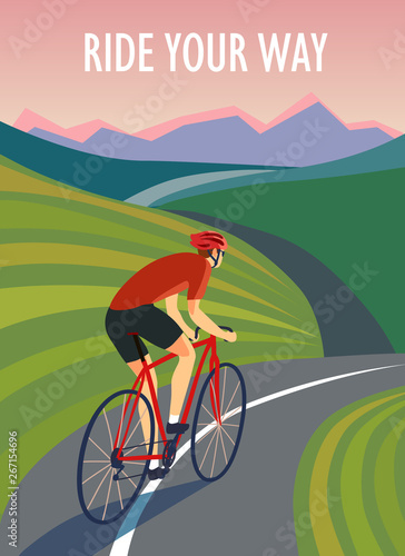 Cyclist  riding near the hills and mountains