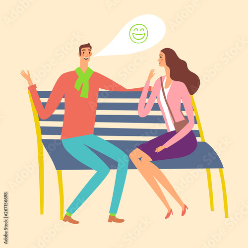 Pair sitting on a bench and laughing