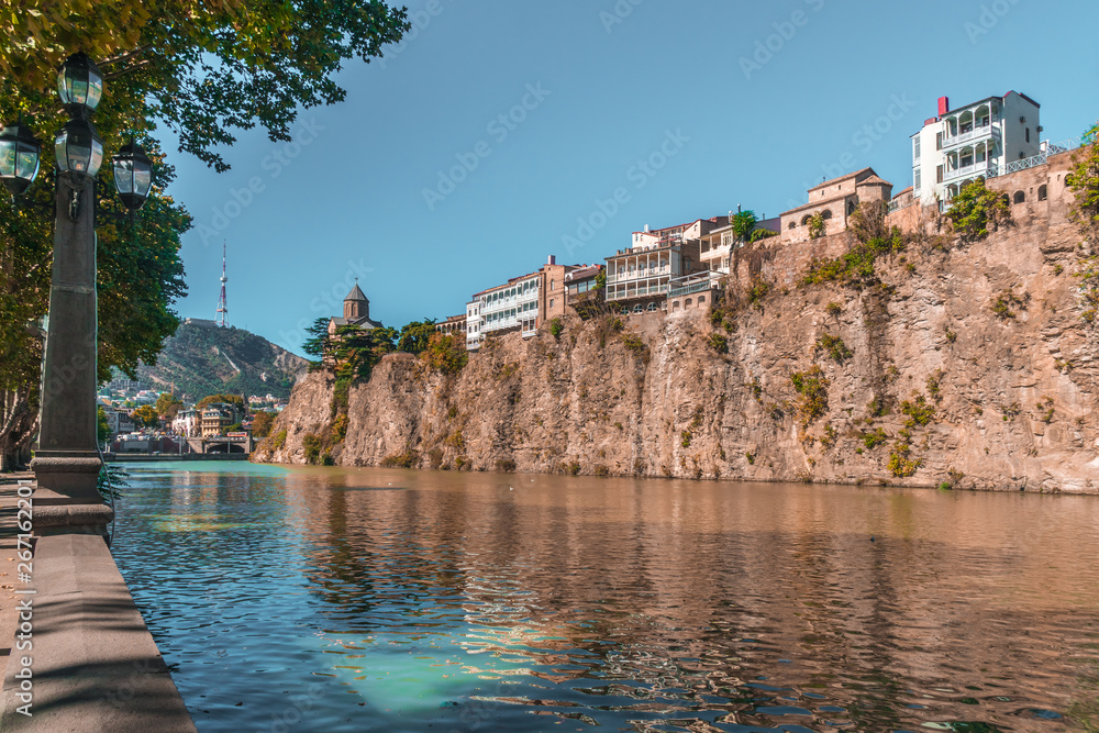 Metekhi church and Houses on the edge of a cliff above the river Kura. Tbilisi, the historic city center