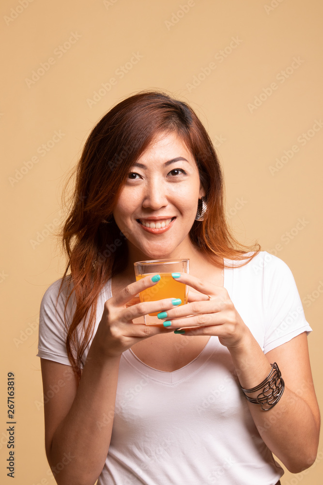 Young Asian woman drink orange juice. Young Asian woman drink orange juice.