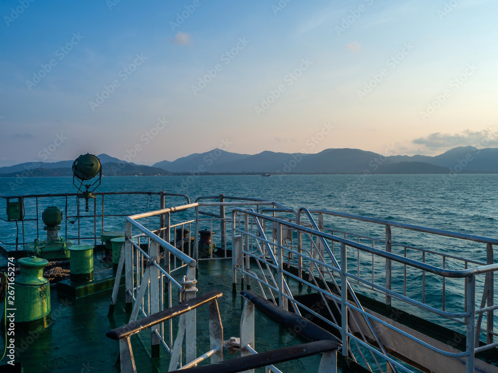 Ferry and Hills on the horizon next to the island of Koh Phangan.Thailand.