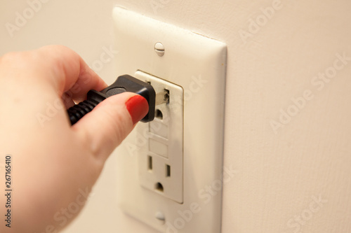 Plugging in a cord photo