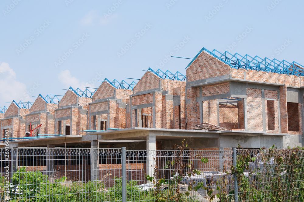 Fototapeta premium Double story luxury terrace house under construction in Malaysia. Designed by an architect with a modern and contemporary style. 