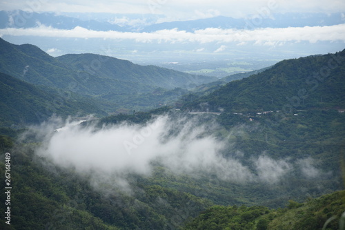 Aerial view of the morning foggy landscape in the mountains. The morning view on the hilltop. © santipong