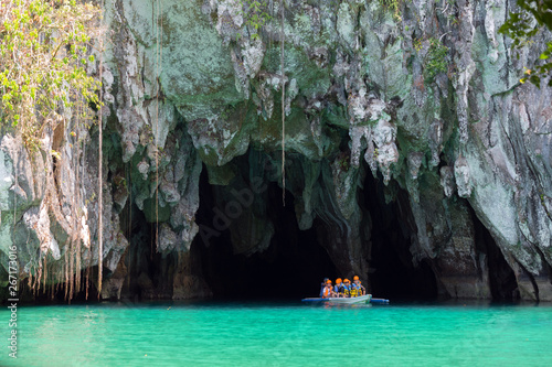Palawan, Philippines - May 3, 2019: A boat with tourists at the entrance to the underground river in Puerto Princesa Subterranean River National Park