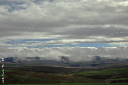 A hilly, green and clouded Overberg landscape