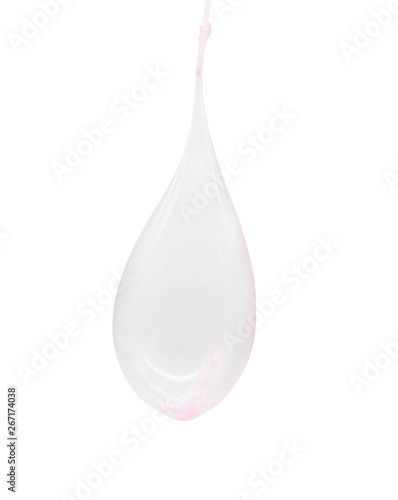 Blowing pink slime with a plastic straw isolated on white