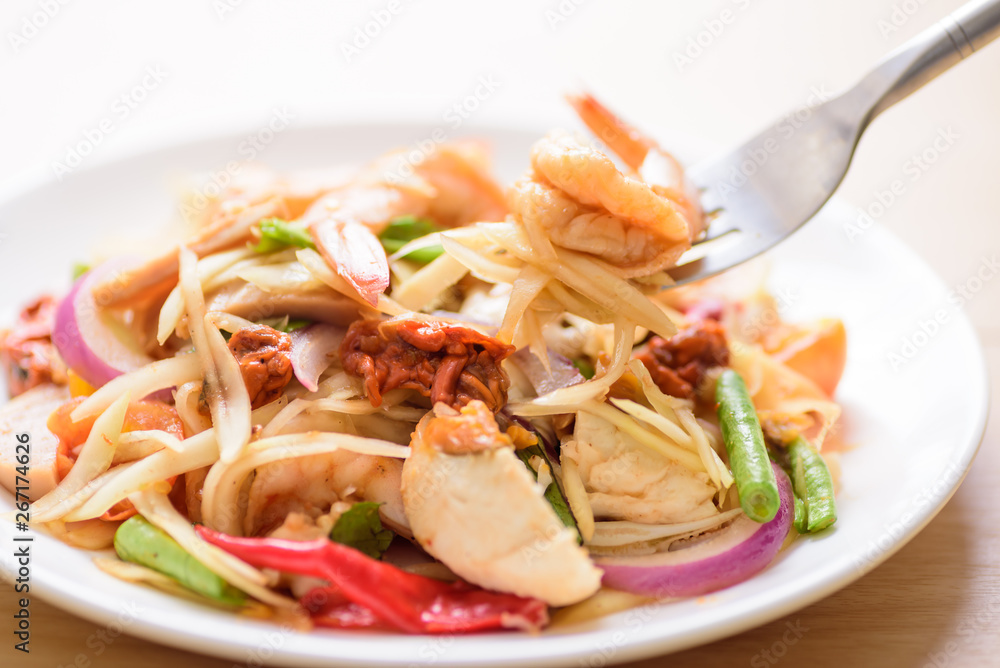 Spicy papaya salad with prawn, Thai food Spicy papaya salad with prawn, Thai food