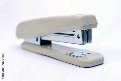 Office stationary Gray stapler with pile of staples
