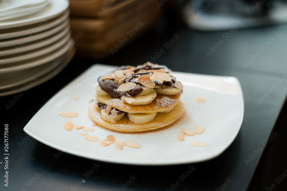 two waffles and banana with chocolate sauce two waffles and banana with chocolate sauce