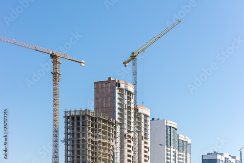 urban construction site against clear blue sky background