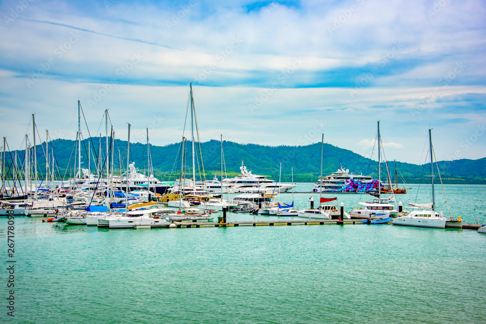 Marina with docked yachts and moored boats in calm blue water in pattaya, Bangkok , Feb 2018