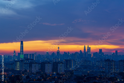 Majestic sunset over downtown Kuala Lumpur, a capital of Malaysia. Its modern skyline is dominated by the 451m-tall Petronas Twin Towers.