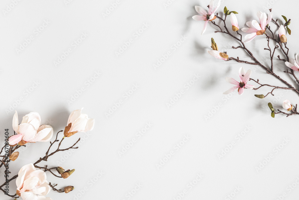 Flowers composition. Magnolia flowers on pastel gray background. Flat lay, top view, copy space