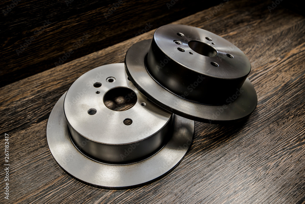 Car brake diske on wooden background Car brake diske on wooden background