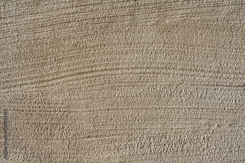 Foto Close up stucco background. Texture of striated stucco wall.
